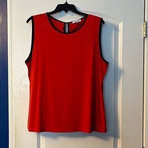 Red orange top with black trim